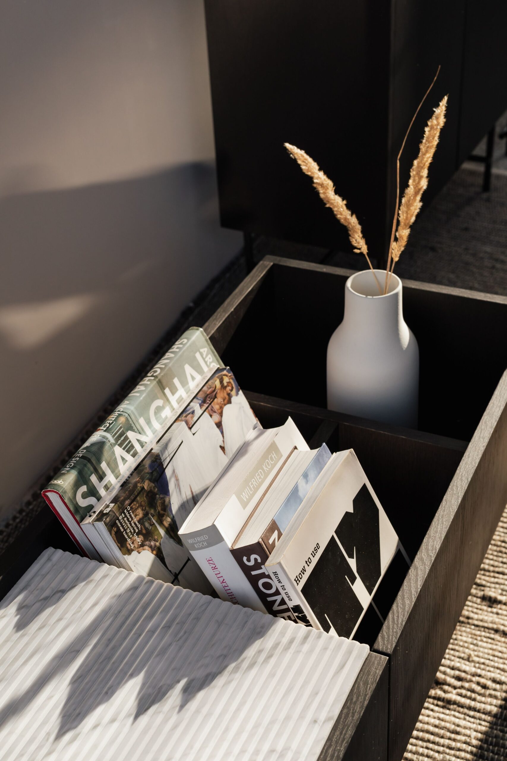 kaboompics_Book on marble shelf