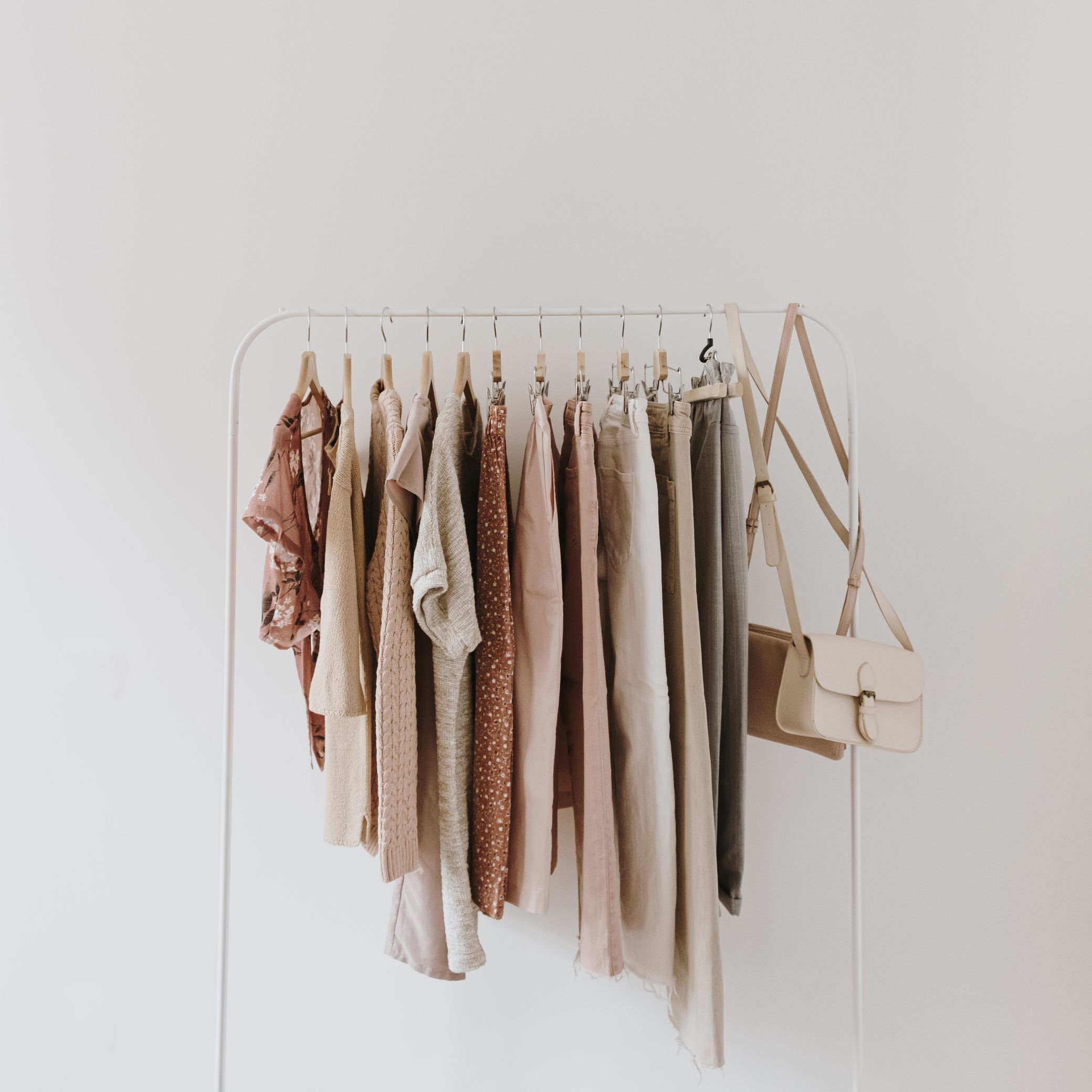 womens-fashion-bright-pastel-clothes-hanger-white-top-view